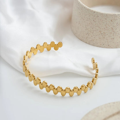 Bransoletka mankietowa w geometrycznym owalnym kształcie z 18-karatowego złota